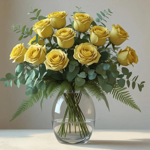 Bouquet of yellow roses in a clear vase on a light surface with a neutral background